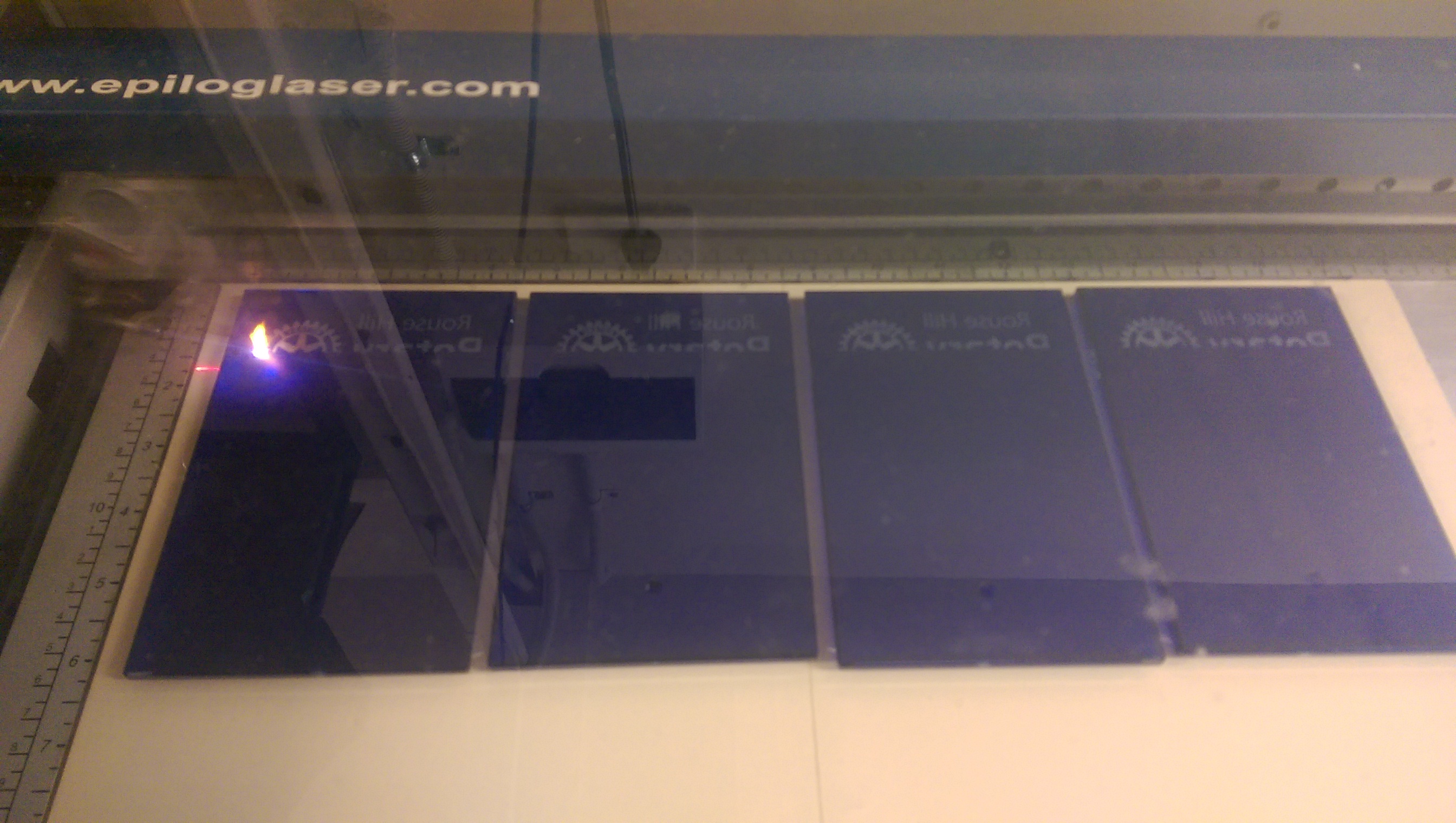 Laser Glass Blue Plaques - laser engraving commencing